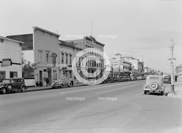 Up the main street of a valley town, Gilroy, California, 1938. Creator: Dorothea Lange.