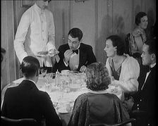 Upper Class People Enjoying a Meal in a Restaurant, 1931. Creator: British Pathe Ltd