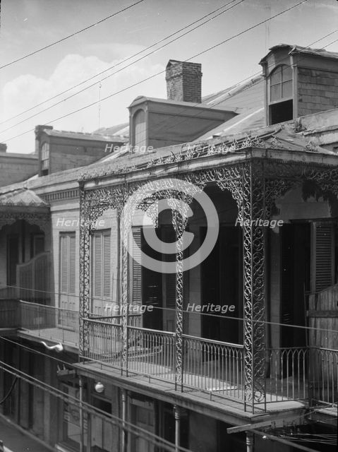 Upper story of building with wrought iron balconies, New Orleans, between 1920 and 1926. Creator: Arnold Genthe.