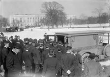 U.S. Capitol - Visitors, Etc., Casket Being Placed In Hearse, 1914. Creator: Harris & Ewing