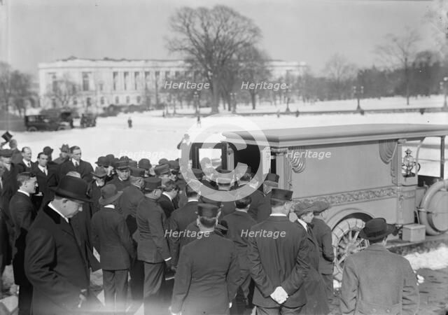 U.S. Capitol - Visitors, Etc., Casket Being Placed In Hearse, 1914. Creator: Harris & Ewing.
