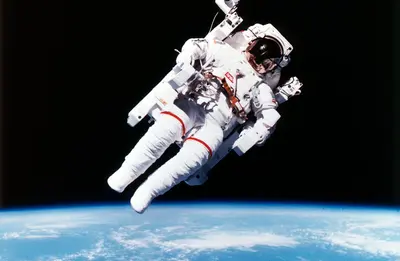 US Astronaut Bruce McCandless spacewalking, 1984. Artist: Unknown