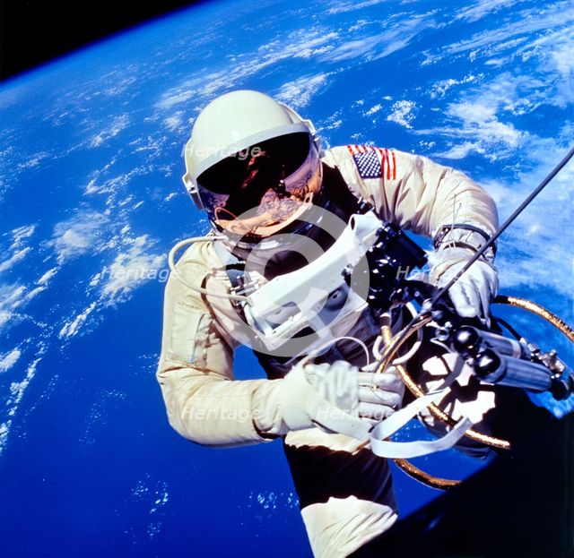 US Astronaut Edward H. White II carrying out external tasks. Artist: Unknown