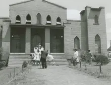 Ushers of an African American church standing on church steps and getting ready to pose..., May 1940 Creators: Farm Security Administration, Jack Delano