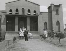 Ushers of an African American church standing on church steps and getting ready to pose..., May 1940 Creators: Farm Security Administration, Jack Delano