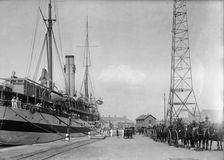 U.S.S. Memphis, Caskets of Dead, Brought Home By U.S. Hospital Ship Solace 1916. Creator: Harris & Ewing