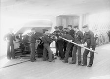 U.S.S. Newark, loading 6-inch gun, between 1891 and 1901. Creator: Unknown
