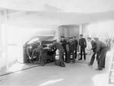 U.S.S. Newark, sighting 6-inch gun, between 1891 and 1901. Creator: Unknown
