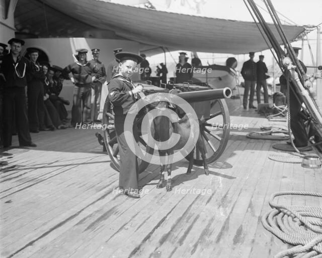 U.S.S. New York, Admiral Sampson's son and Pitch the mascot, between 1893 and 1901. Creator: William H. Jackson.