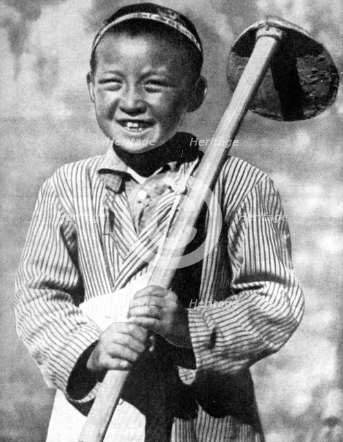 Uzbek schoolboy working on a farm, 1936. Artist: Unknown