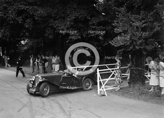 VM Roberts' MG Magnette NA, winner of a bronze award at the MCC Torquay Rally, July 1937. Artist: Bill Brunell.