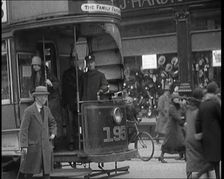 Volunteer Male Civilian Conducting a Tram With a Police Escort Sitting Beside Him, 1926. Creator: British Pathe Ltd