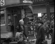 Volunteer Male Civilian Conducting a Tram With a Police Escort Sitting Beside Him, 1926. Creator: British Pathe Ltd