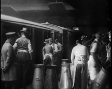 Volunteer Male Civilians Lifting Milk Churns and Helping Deliver Milk, 1926. Creator: British Pathe Ltd