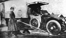 Volunteer English woman driver washing down her ambulance, Cambridge, World War I, 1915. Creator: Unknown
