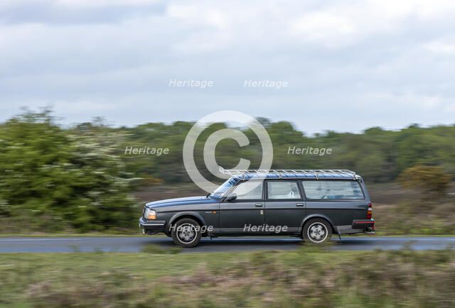 Volvo 244 Estate driving in New Forest, 2012. Creator: Tim Woodcock.