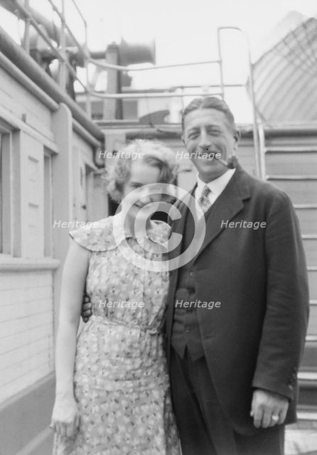 Von Lueckner, Felix, Count, and Countess, standing outdoors, 1931 June 5. Creator: Arnold Genthe.