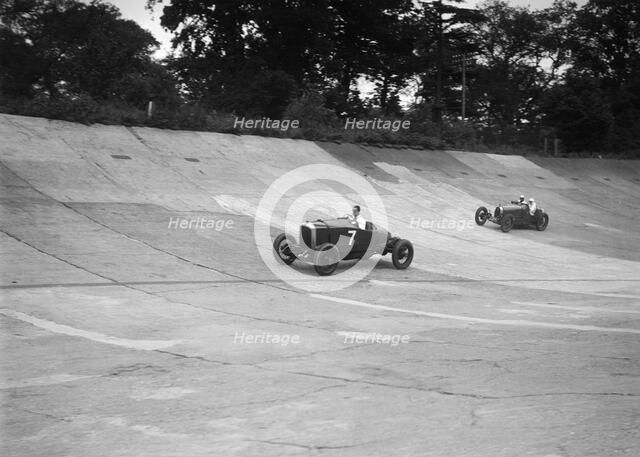 Vauxhall 30/98 and Bugatti Type 37 racing on the banking at Brooklands. Artist: Bill Brunell.