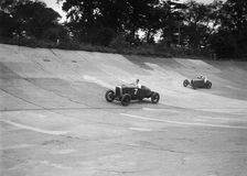 Vauxhall 30/98 and Bugatti Type 37 racing on the banking at Brooklands. Artist: Bill Brunell