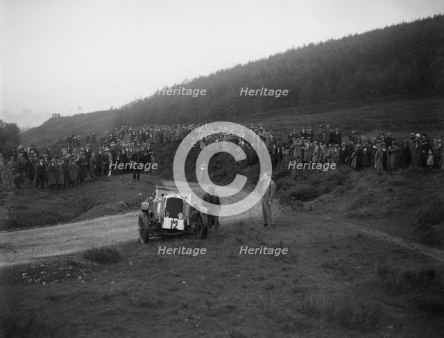 Vauxhall 30-98 of Humphrey Cook off the road at the Caerphilly Hillclimb, Wales, 1922. Artist: Bill Brunell.