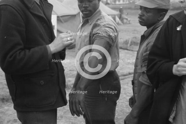 Vaccination in the camp for Negro flood refugees at Marianna, Arkansas, 1937. Creator: Walker Evans.