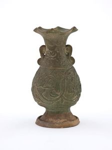 Vase with fluted mouth and molded floral design, early 1200s. Creator: Unknown