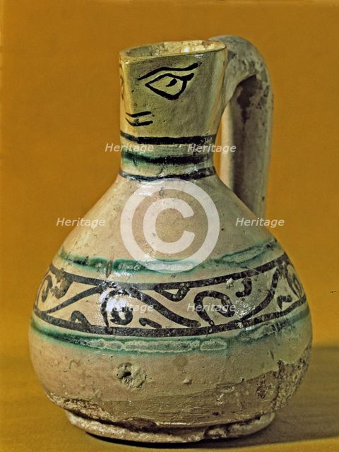 Vase with scoop anthropomorphic shaped decorated in green and black. Manresa pottery discovered i…