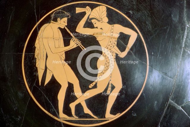 Vase-painting of a youth playing the flute and a woman dancing, 6th century BC. Artist: Epikektos