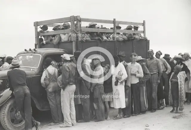 Vegetable pickers, migrants, waiting after work to be paid, near Homestead, Florida, February 1939. Creators: Farm Security Administration, Marion Post Wolcott.