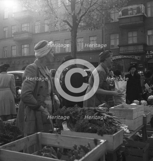 Vegetable stall in the market, Malmö, Sweden, 1947. Creator: Otto Ohm.