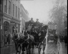 Vehicles Passing Along a Busy British Street, 1921. Creator: British Pathe Ltd