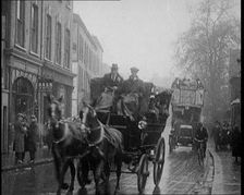 Vehicles Passing Along a Busy British Street, 1921. Creator: British Pathe Ltd