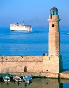 Venetian lighthouse and the ferry to Piraeus, Rethymnon, Crete, Greece
