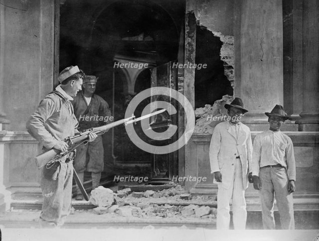 Vera Cruz: Front door of Naval Academy bombarded by "CHESTER" & "PRAIRIE", 1914. Creator: Bain News Service.