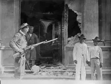 Vera Cruz: Front door of Naval Academy bombarded by "CHESTER" & "PRAIRIE", 1914. Creator: Bain News Service