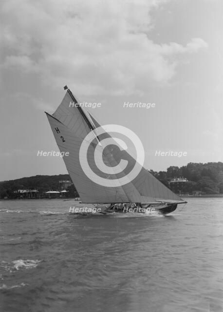 'Verbena' (H2), a gaff rig 8 Metre, sailing close-hauled, 1911. Creator: Kirk & Sons of Cowes.