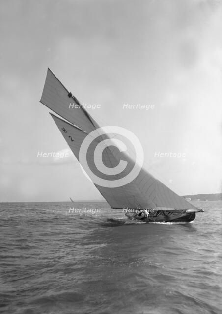 'Verbena' (H2), a gaff rig 8 Metre, sailing close-hauled, 1911. Creator: Kirk & Sons of Cowes.