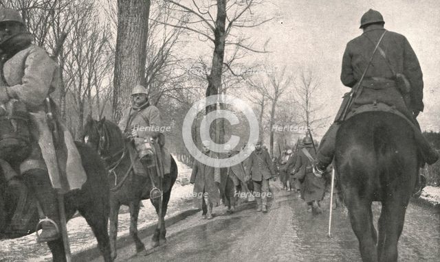 'Verdun; Apres l'attaque: 68 Allemands, pris au bois des Caures, entrent a Verdun...1916', 1924) Creator: Unknown.