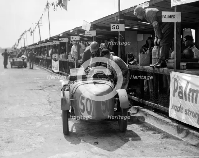 Vernon Balls and AB Gilbert's Austin Ulster at the JCC Double Twelve race, Brooklands, 8/9 May 1931. Artist: Bill Brunell.