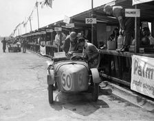 Vernon Balls and AB Gilbert's Austin Ulster at the JCC Double Twelve race, Brooklands, 8/9 May 1931. Artist: Bill Brunell