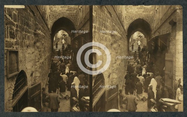 Via Dolorosa, Jerusalem. Pilgrims at station of the Cross (Stereograph), 1913.