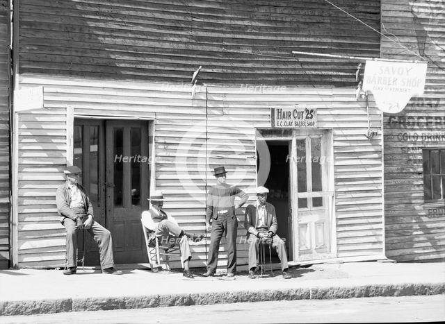Vicksburg Negroes and shop front, Mississippi, 1936. Creator: Walker Evans.
