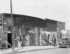 Vicksburg Negroes and shop front, Mississippi, 1936. Creator: Walker Evans