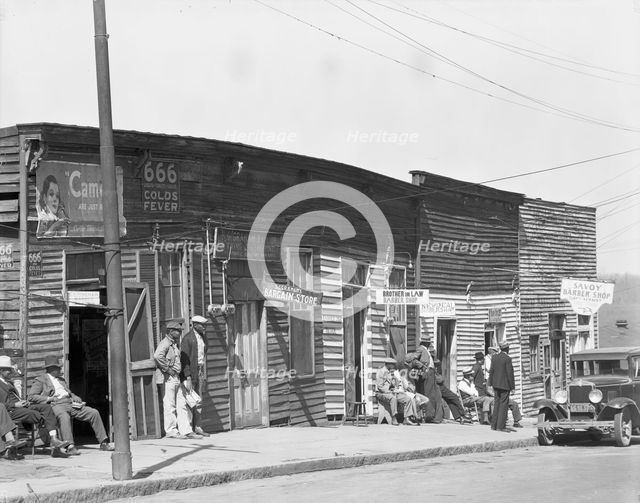 Vicksburg Negroes and shop front, Mississippi, 1936. Creator: Walker Evans.