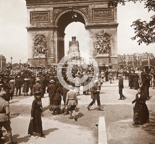 Victory celebration, civilians at the Arc de Triomphe, Paris, France, July 1919.  Artist: Unknown.