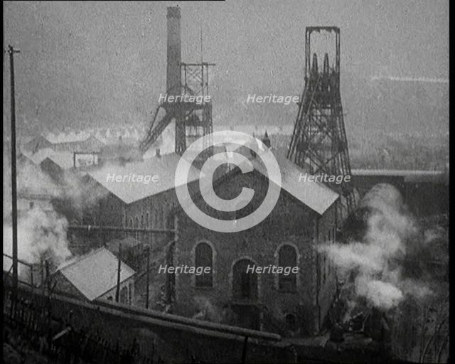 Views Over an Industrial Site in the United Kingdom. Chimney Stacks Are Smoking, 1921. Creator: British Pathe Ltd.