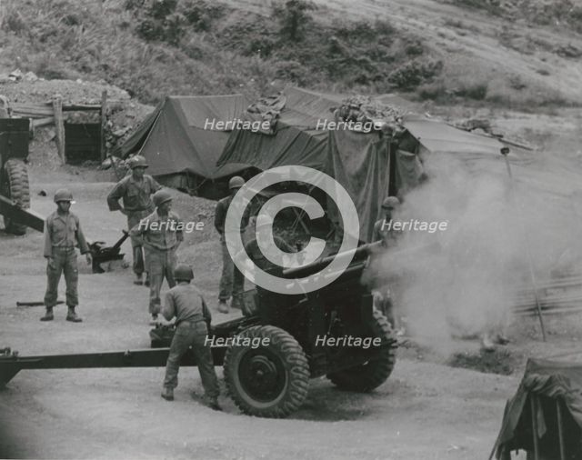 Vietnamese artillerymen fire from a mountain position during field training, 1962. Creator: United States Army.