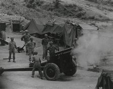 Vietnamese artillerymen fire from a mountain position during field training, 1962. Creator: United States Army
