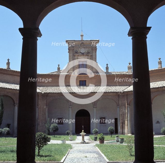View through a round arch of the courtyard of the former Literary University of Huesca, which tod…