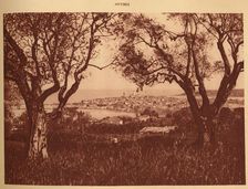 View through the olives-trees to Antibes 1930. Creator: Unknown